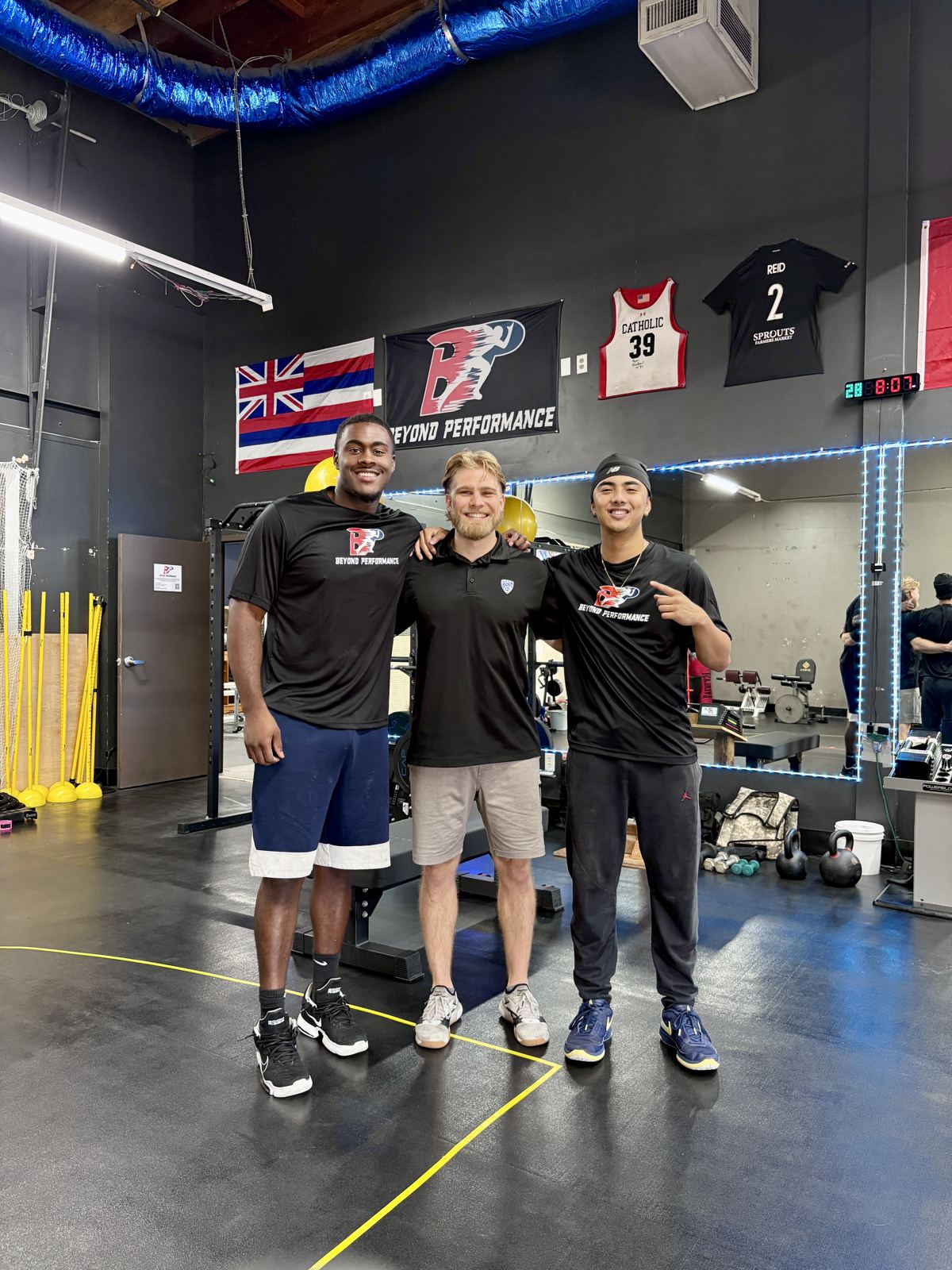 Coach Francis with two athletes
