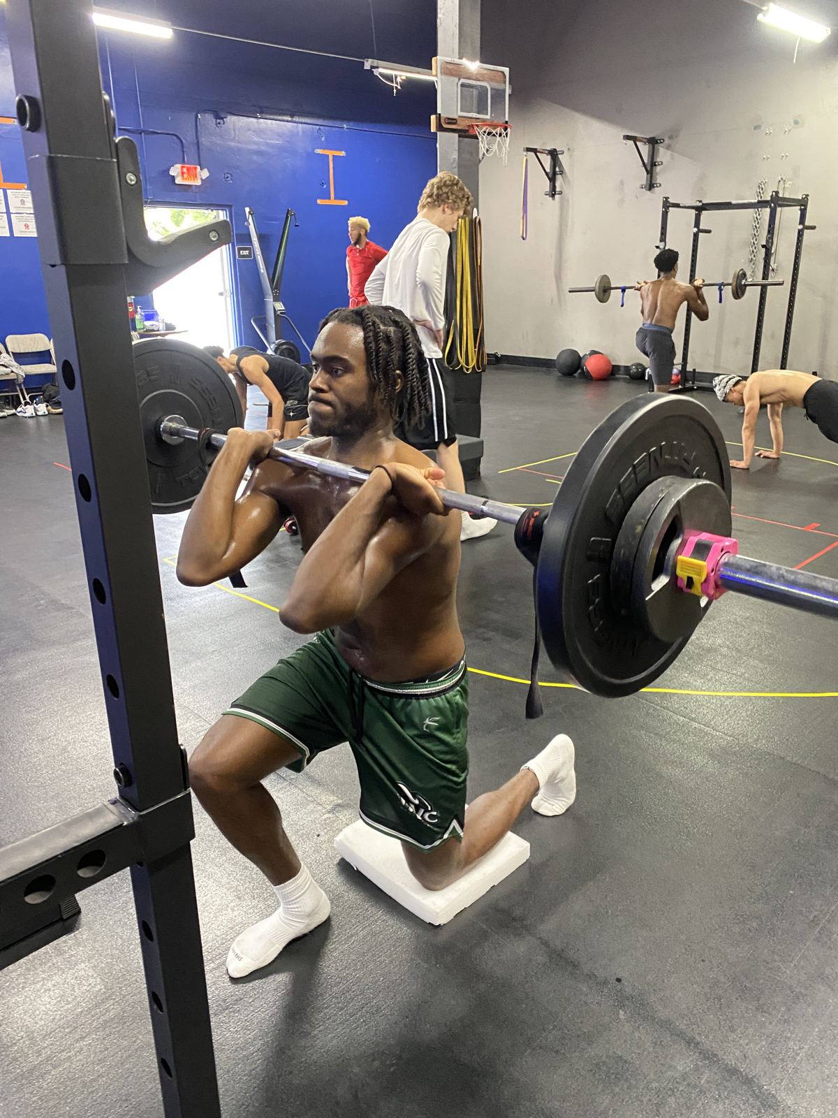 Athlete doing a half-kneeling front squat