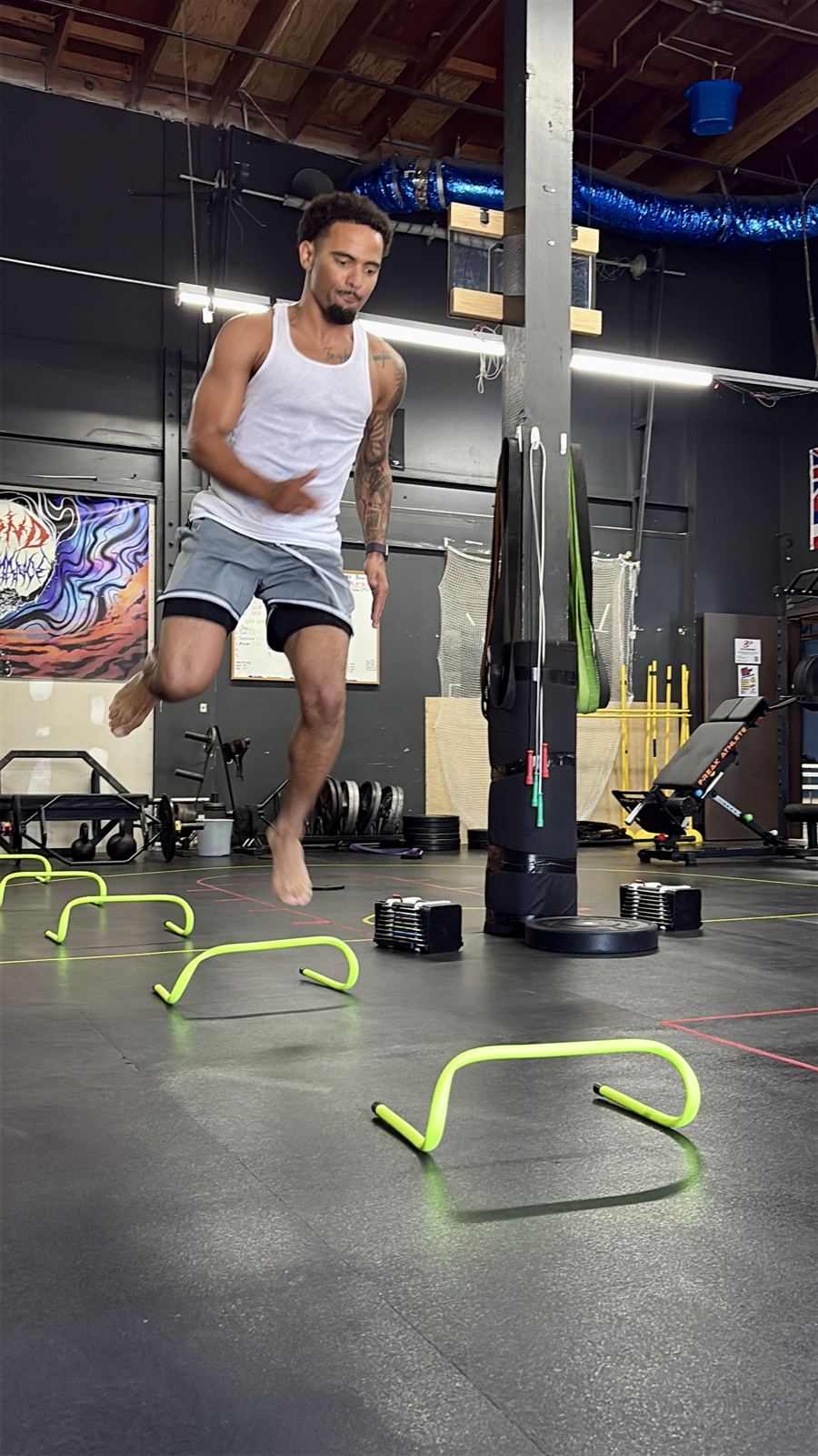 Pro basketball player doing hurdle hops