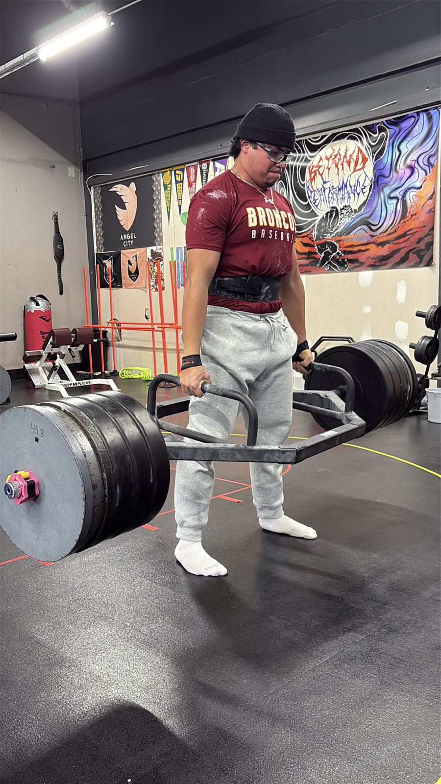 Baseball player pulling a heavy trap-bar deadlift